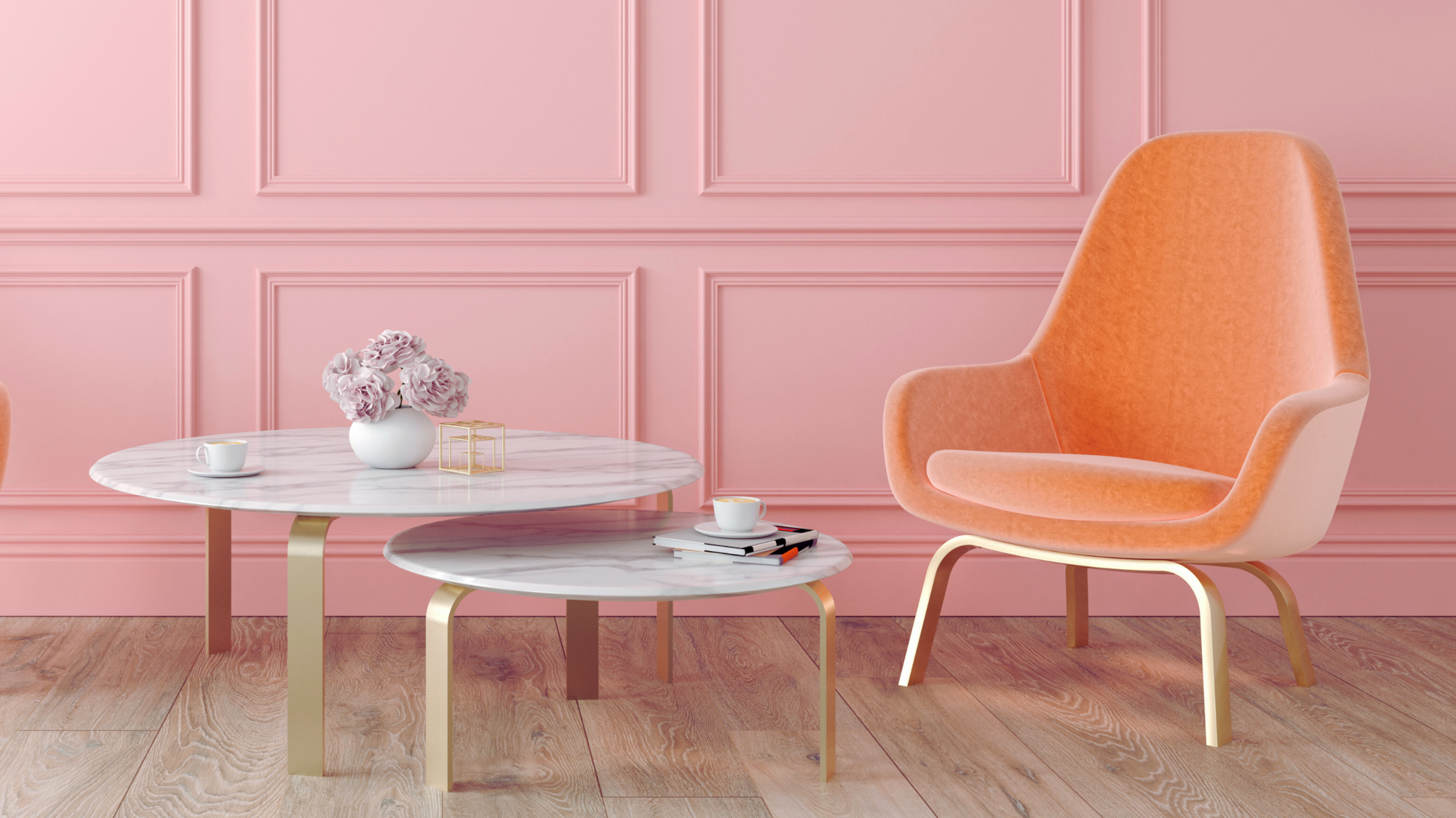 A pink panelled wall adds a touch of elegance, and the light wood flooring keeps everything feeling airy.