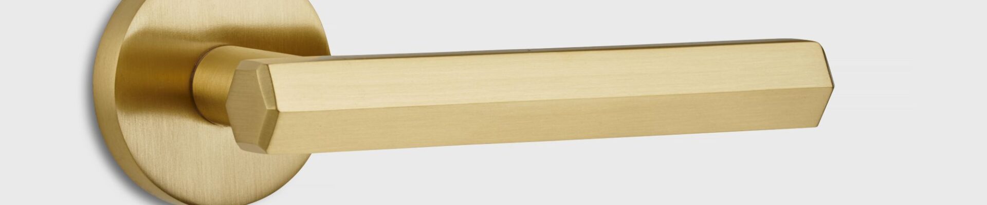 A gold door handle. This type of handle is commonly used for interior doors and offers a sleek, contemporary aesthetic.