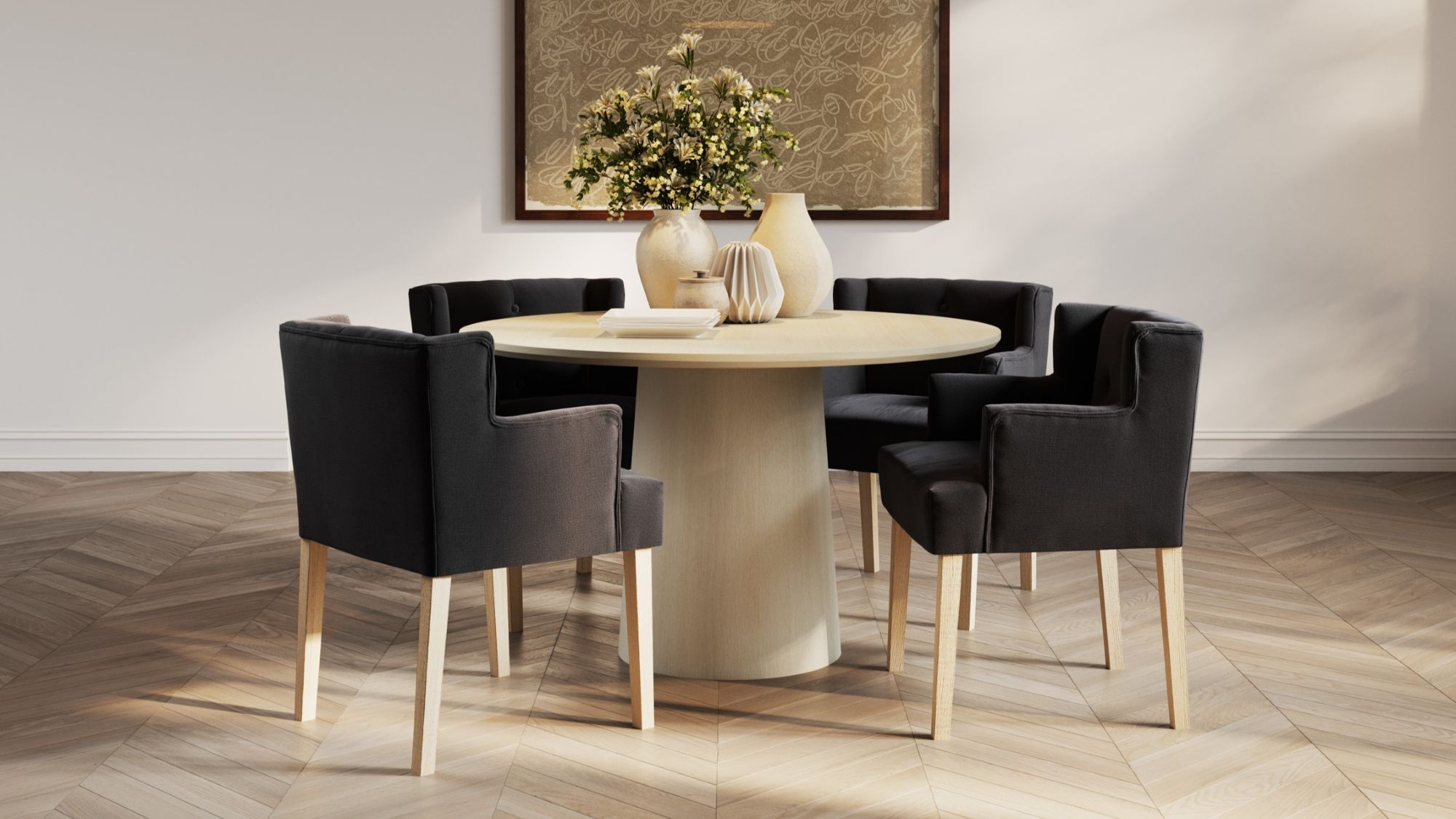 This lifestyle image showcases four Ari-Winged Dining Armchairs in anthracite, a dark gray colour, surrounding a light wood dining table. The chairs feature a clean, contemporary design with a winged backrest that curves slightly around the sides. They are upholstered in a linen blend fabric and rest on light wood legs, which complement the table.