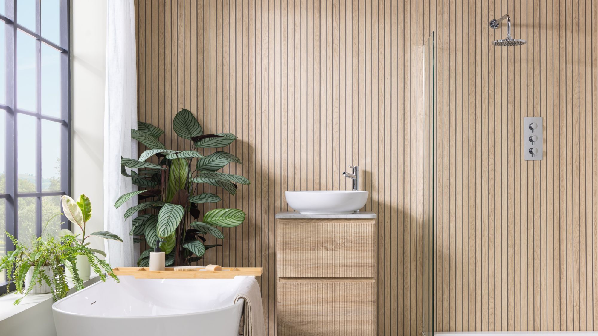 Image shows a bathroom with light wood wall panels laid vertically in a slatted effect.