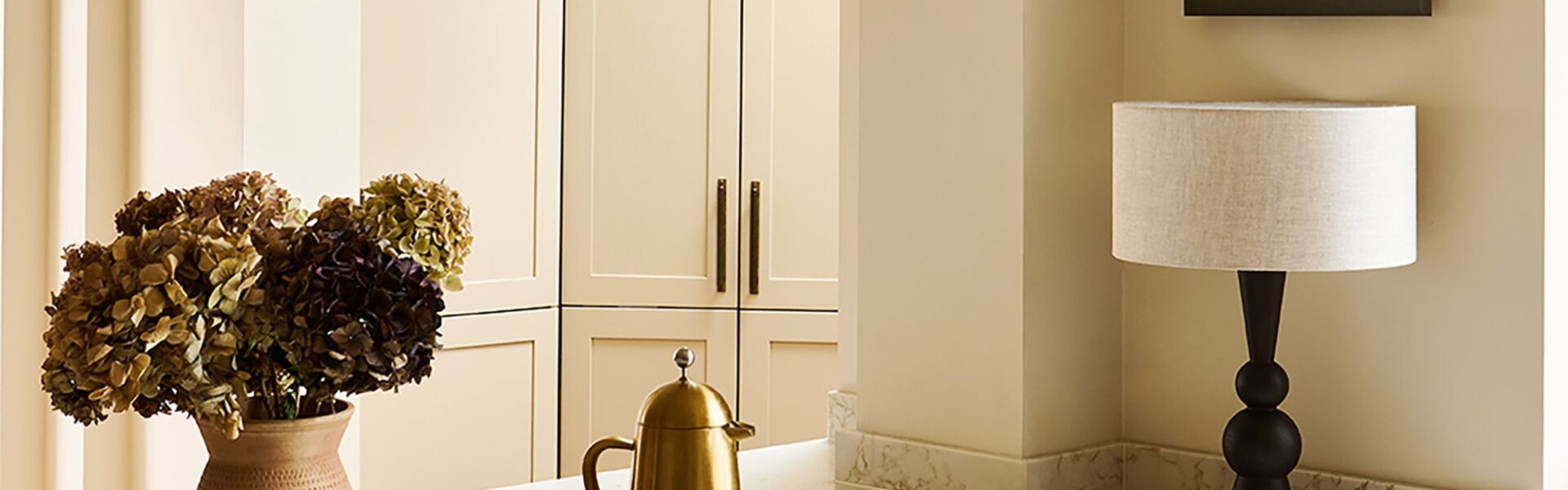 The image shows Thorndown's Whey White Wall Paint. It's an off-white cream with a light, buttery hue and a flat matt finish. It's an eco-friendly, water-based paint with minimal VOCs, and is designed to be durable and washable. It can be used on walls, ceilings, metal radiators, and interior wood like furniture and trim.