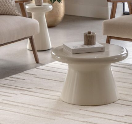 A modern, neutral-toned living area, focusing on a rectangular Tufted Tonal Rug in white or a very light cream colour.