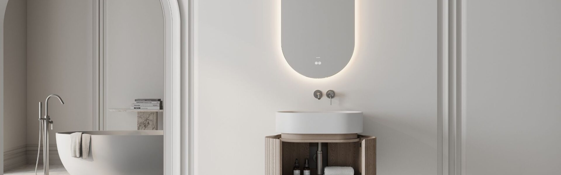 A modern, minimalist bathroom design. The central focus is the vanity area, which features: a wall-mounted, oval, LED-backlit mirror, a floating vanity unit with a curved, natural wood finish and open storage, a white, counter-top basin bowl and wall-mounted taps.
