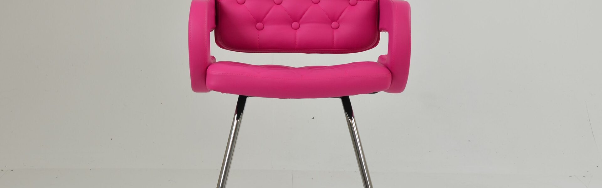 A modern Parga office chair featuring vibrant hot pink leather upholstery with button tufting and a sleek chrome sled-style base.