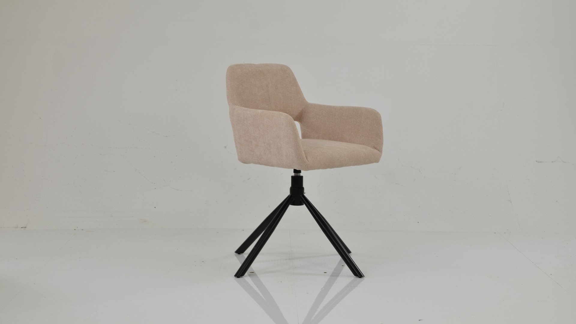 Odense swivel dining chair in natural cream fabric with an upholstered bucket seat and black splayed metal legs