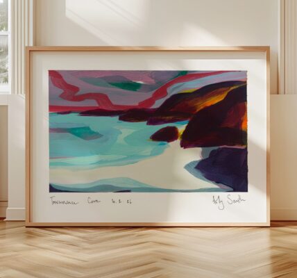 A framed abstract painting of Trevaunance Cove hanging on a light-coloured wall above a wooden herringbone floor.